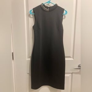 Little black dress with silver collar detail. Calvin Klein. Size 6.